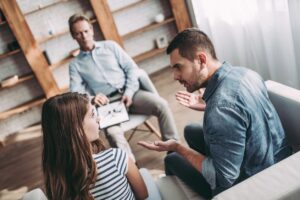 Couple participating in a counseling session with a therapist